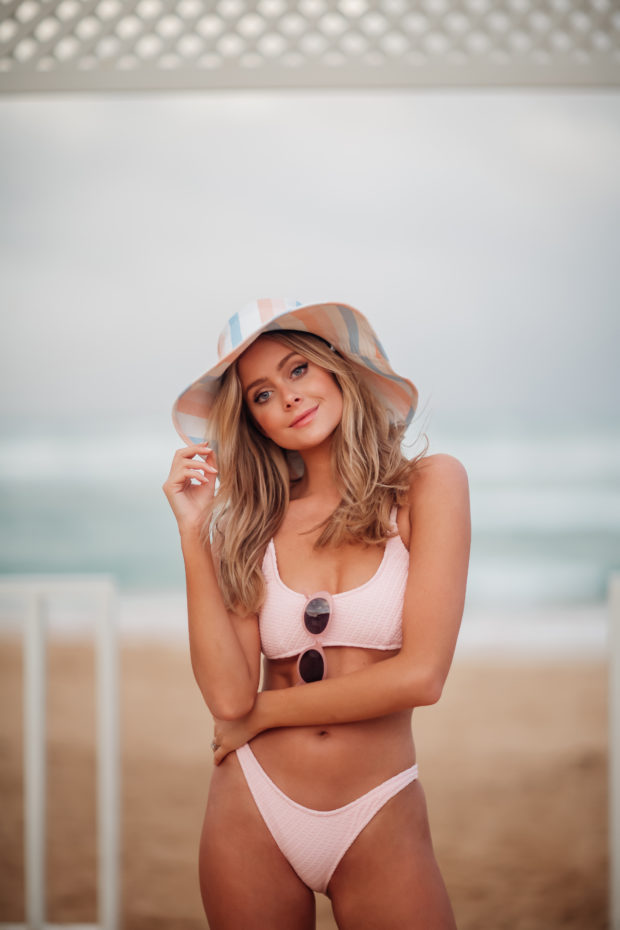 Hannah Godwin at the beach posing in bikini